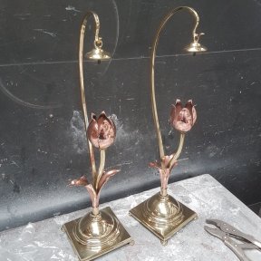 A pair of antique light fixtures