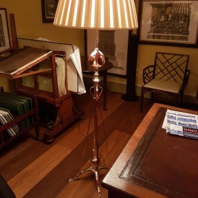 Antique standard lamp in home office