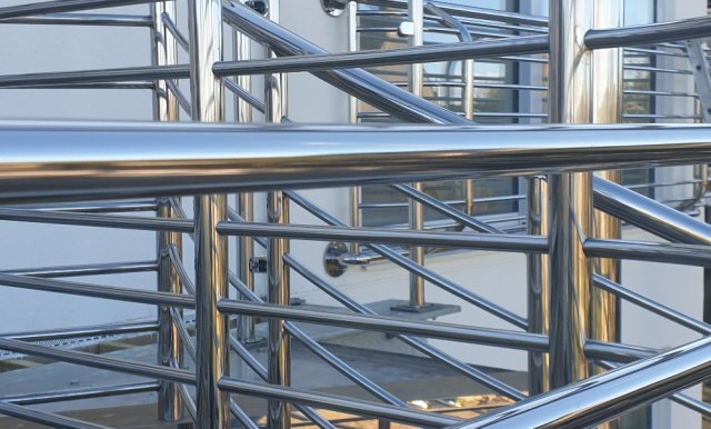 Apartment balcony balustrades, metalwork polished on-site at Poole
